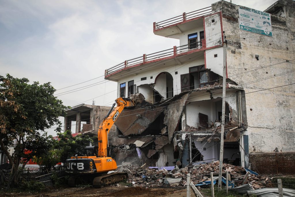 Bulldozer demolishing a hotel-cum-restaurant belonging to a Muslim in Nuh, Haryana. Photo: Meer Faisal.